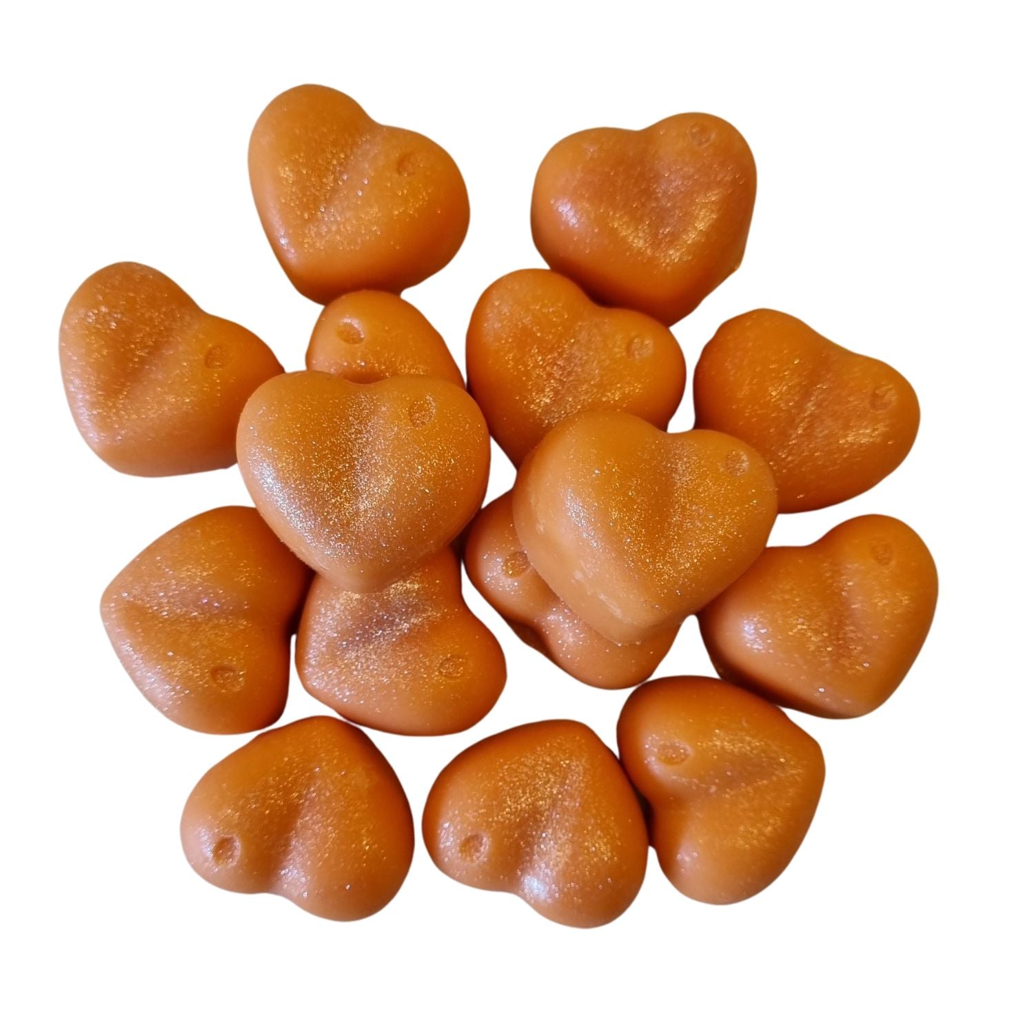 a group of orange heart shaped soy wax melts