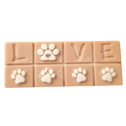 A brown Scented Wax Melt bar with love and white paw prints