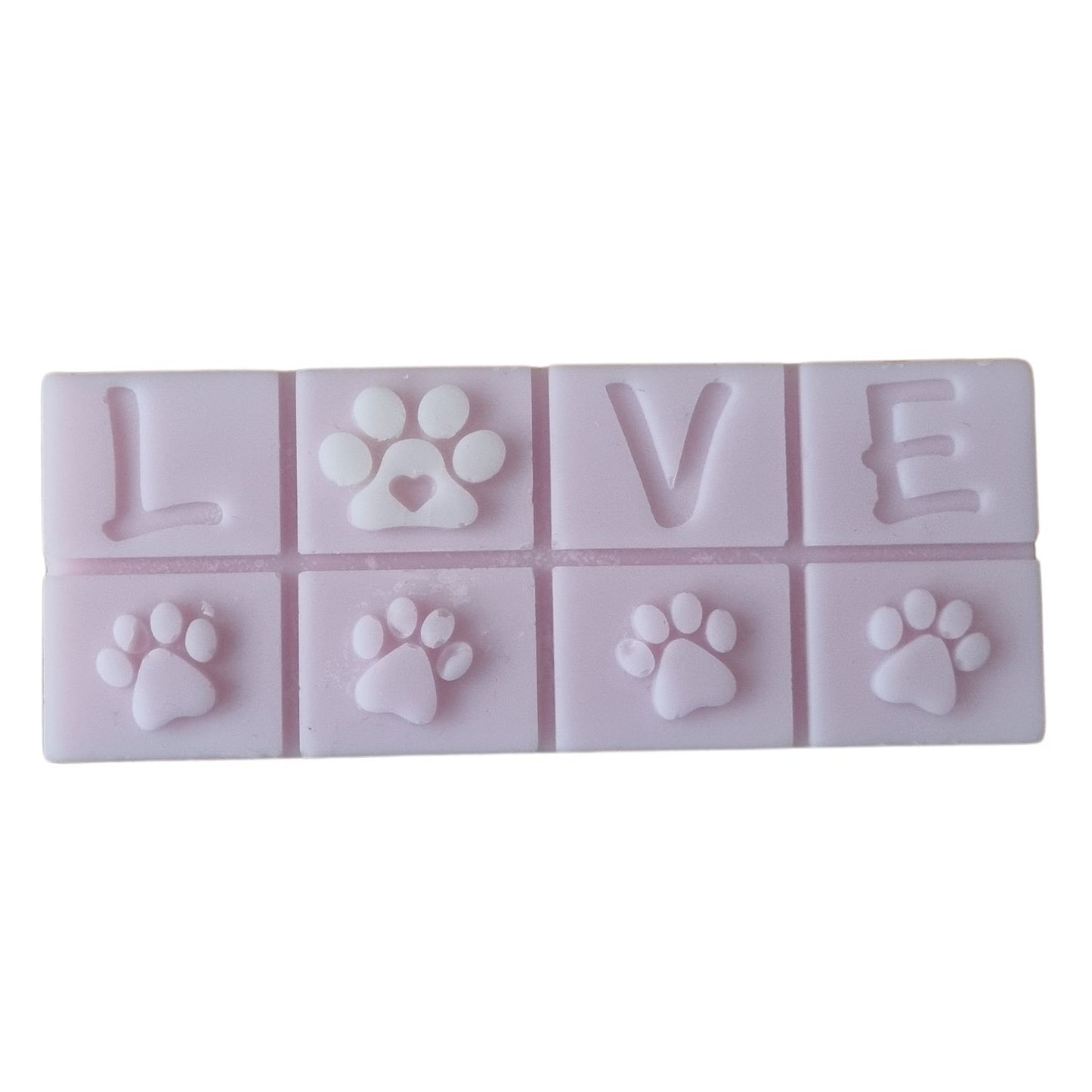 A lilac colored wax melt bar with love and paws design