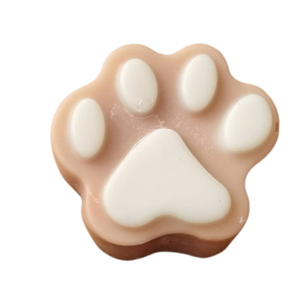 a brown Paw Shaped Soy Wax Melt  with white pads