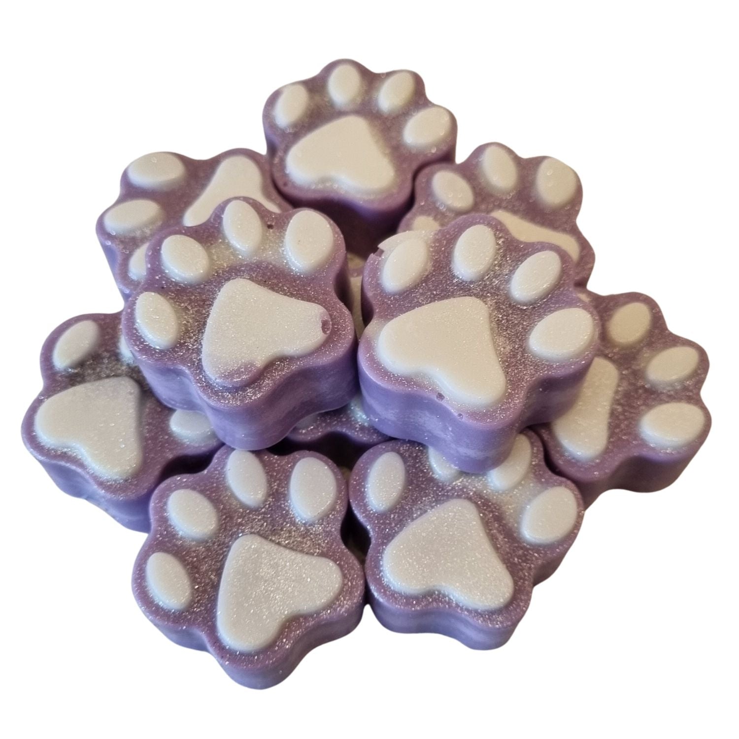 a group of violet paw shaped wax melts with white paw pads