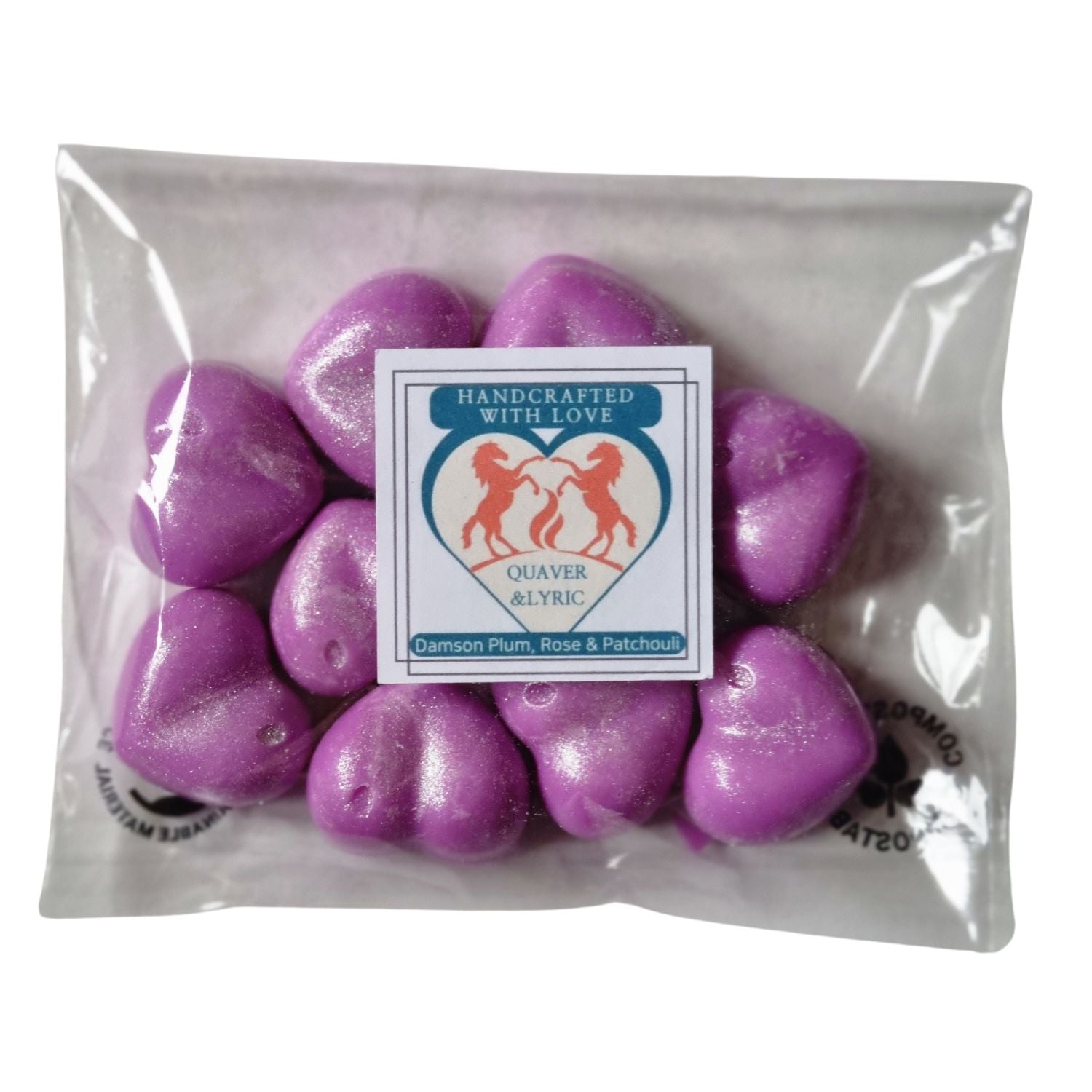 ten bright pink heart shaped soy wax melts in a packet with Quaver and Lyric branding
