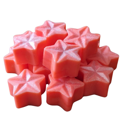 A pack of 15 pink, star-shaped Soy Wax Melt Stars by Quaver&Lyric with a glossy, shimmery finish, stacked together against a white background.