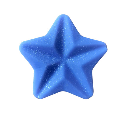 The Soy Wax Melt Stars Quaver&Lyric Pack of 15 by Quaver&Lyric features handmade, blue five-pointed star melts with a shiny, glittery finish, shown from above on a white background.