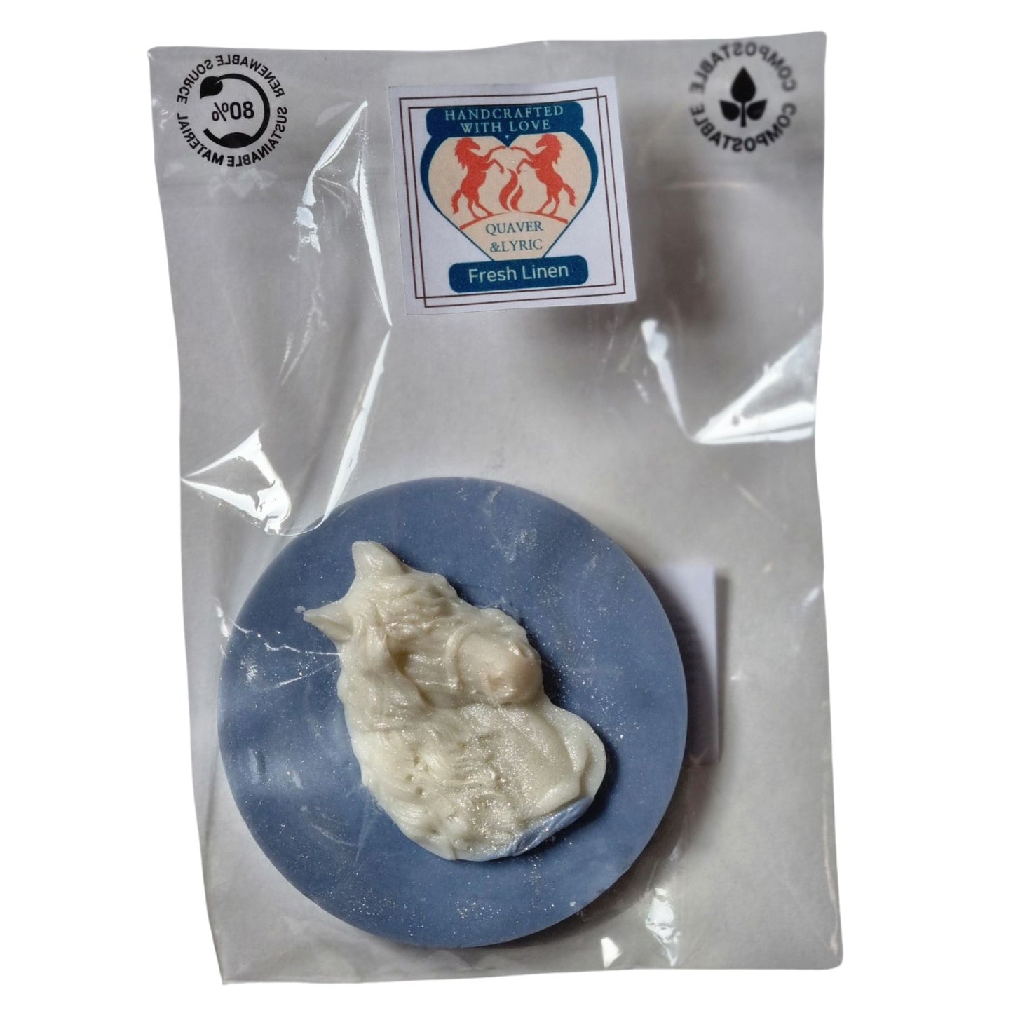 A packet with quaver and lyric rearing horse branding containing a blue coloured disc shaped wax melt with a white wax horses head with a flowing mane and forelock.