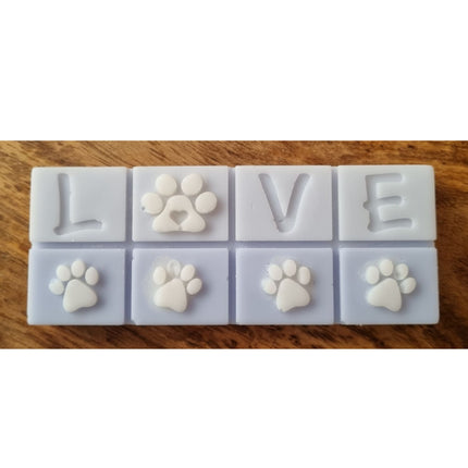 A light blue Scented Wax Melt bar with love and white paw prints