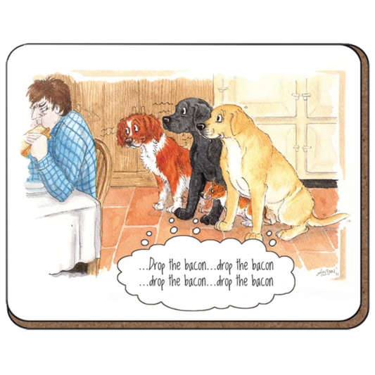 Coaster featuring a cartoon of a grumpy man in his kitchen eating a bacon sandwich with three dogs sitting down eagerly looking at him. Thought bubble reads "drop the bacon.. drop the bacon" 