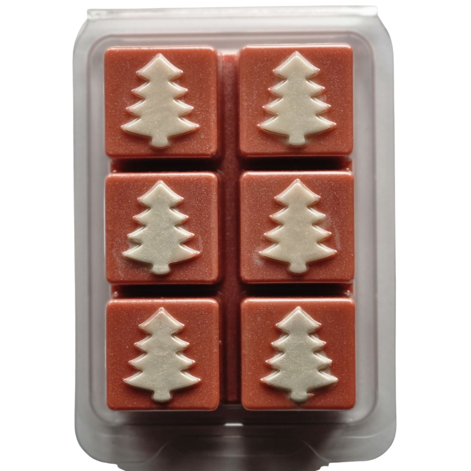 Christmas fragrance wax melts in a Christmas tree design clamshell. With white scented wax christmas trees on red brown scented cubes.