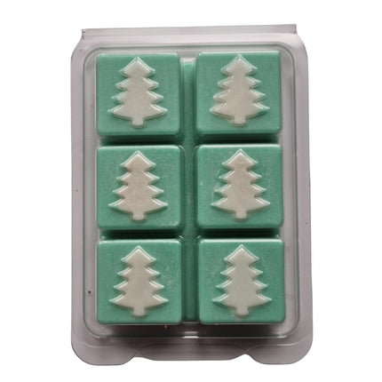 Christmas fragrance wax melts in a Christmas tree design clamshell. With white scented wax christmas trees on green scented cubes.