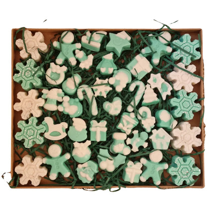 The Quaver&Lyric Christmas Soy Wax Melts Gift Set includes blue and white holiday-themed wax melts shaped like snowflakes, gingerbread people, and presents—a charming handmade gift with a cozy festive scent.